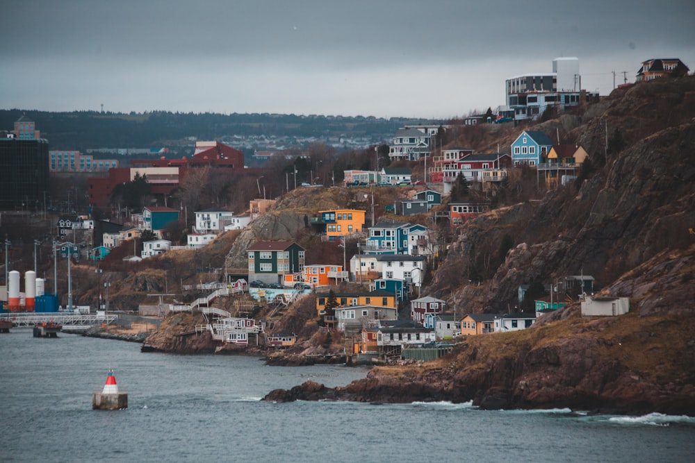 houses near body of water during daytime