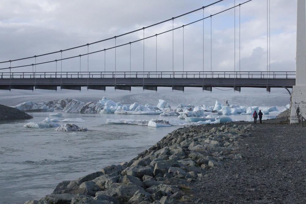 gray bridge over water during daytime