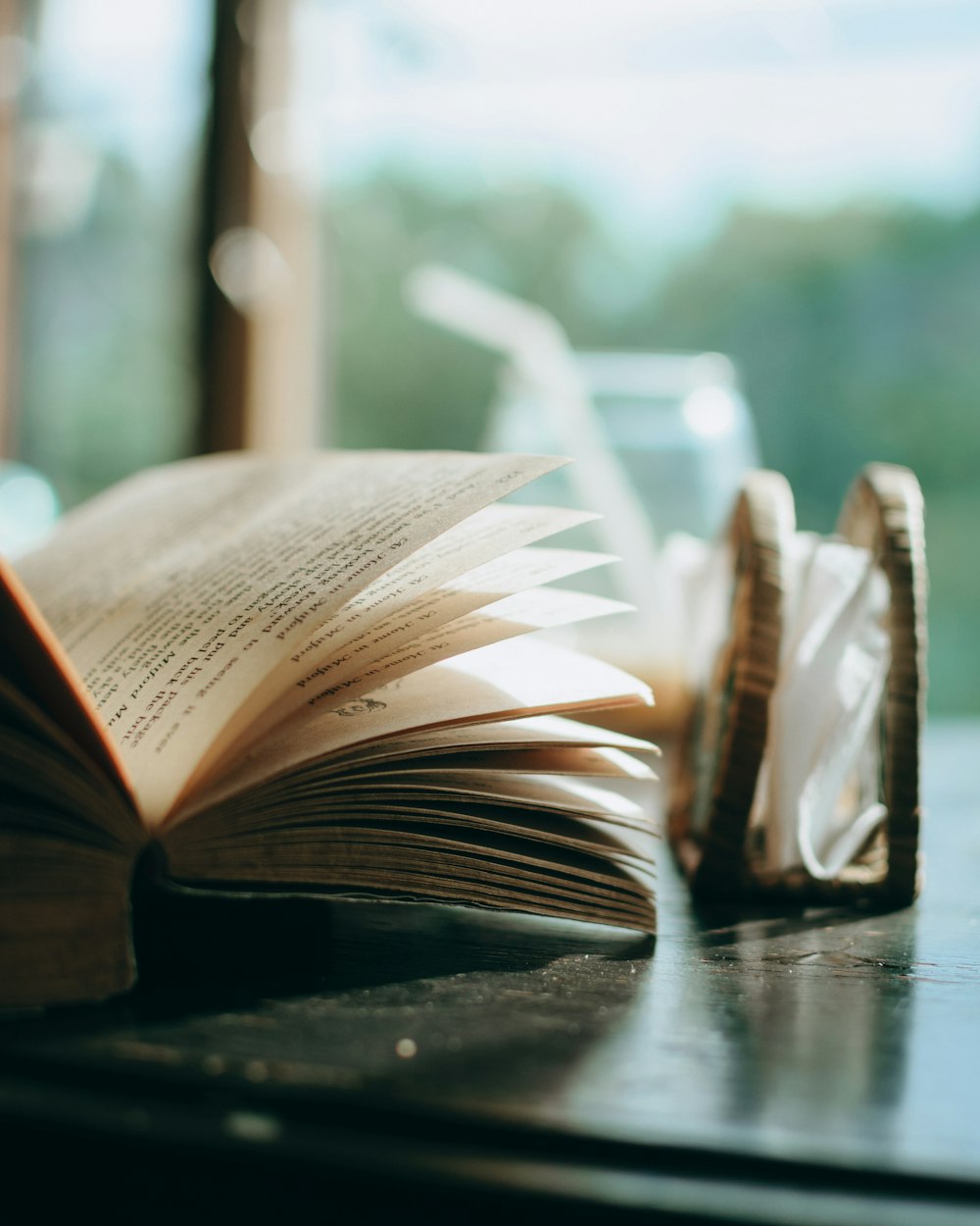 opened book on black table