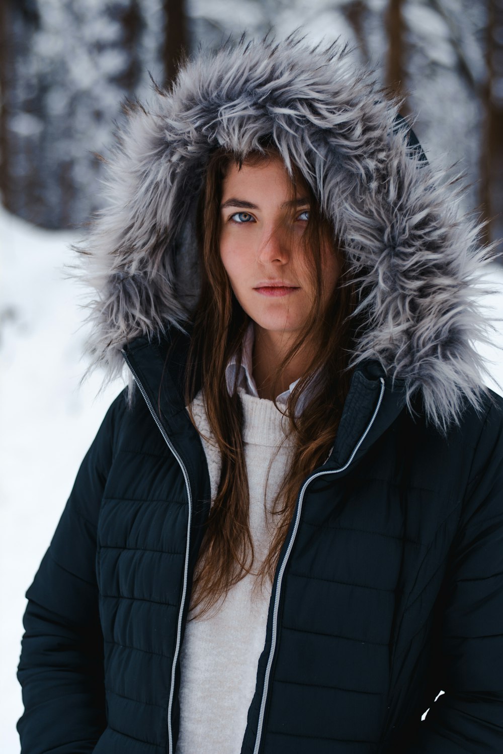 woman in black and white fur lined jacket