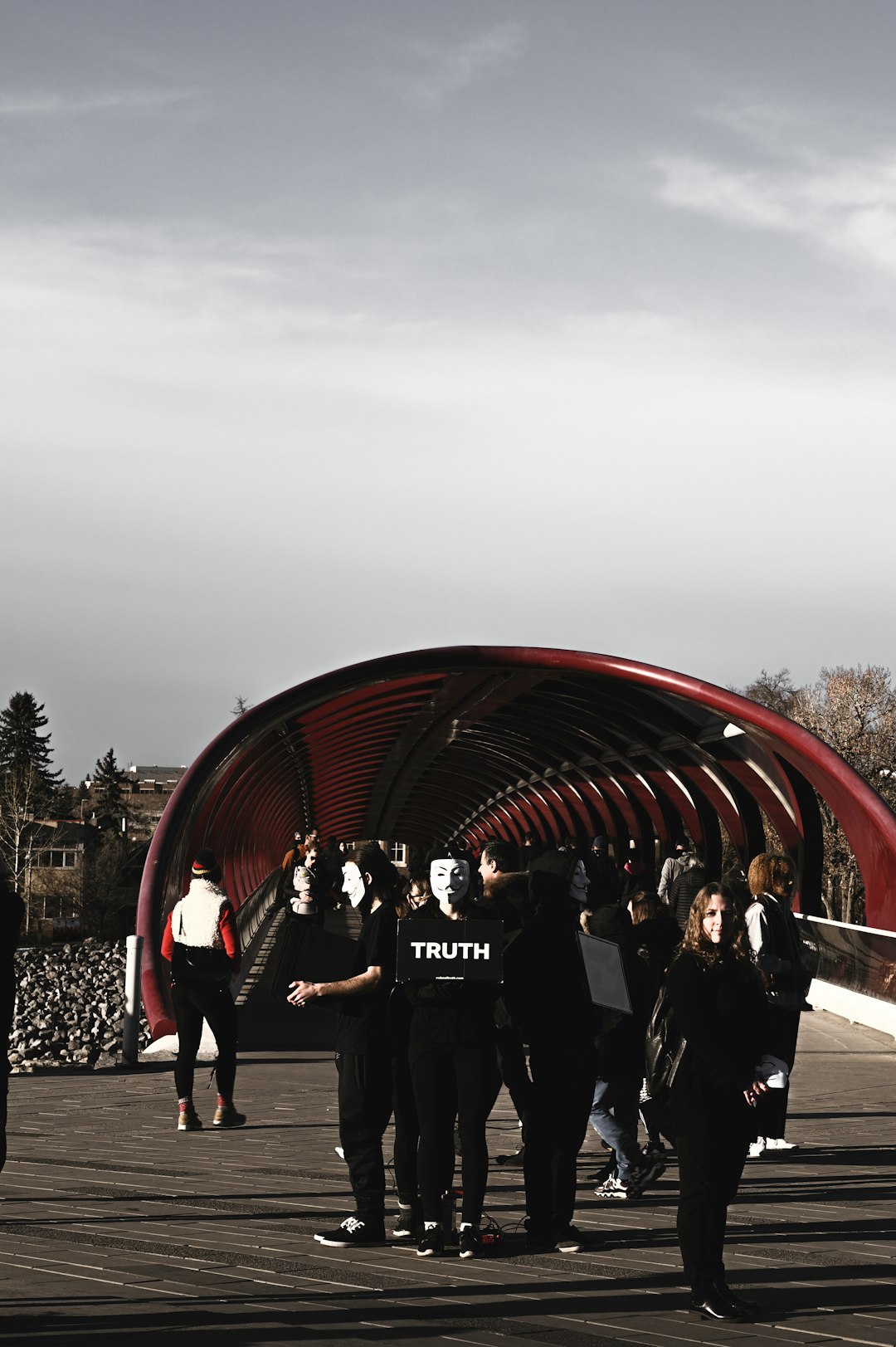 people standing near red round structure during daytime