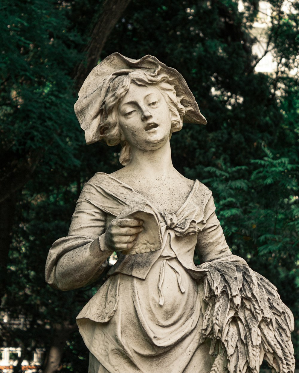 angel statue in grayscale photography