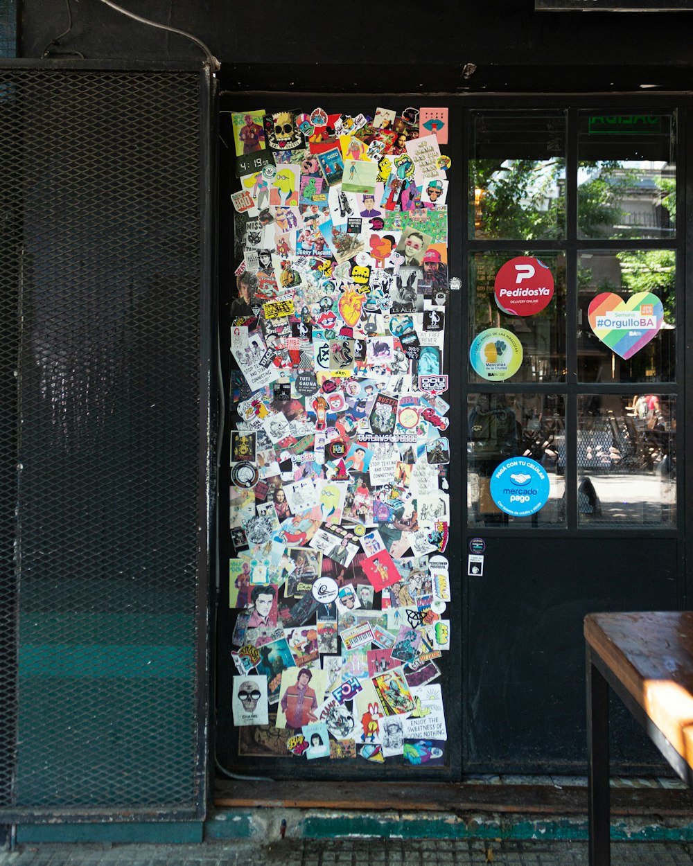 assorted stickers on glass window