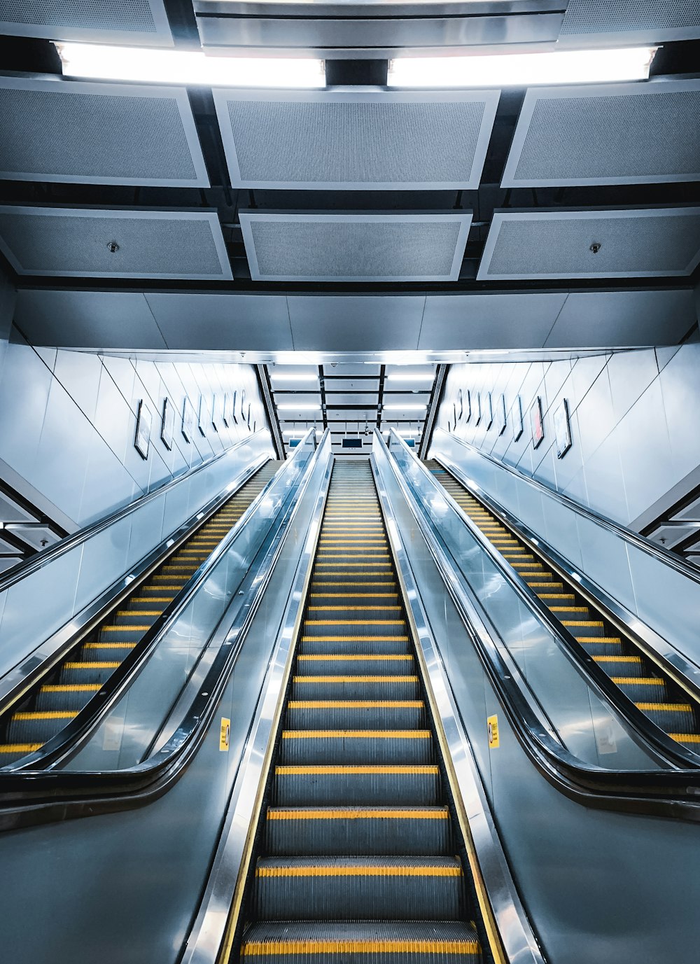 black and silver escalator in a room