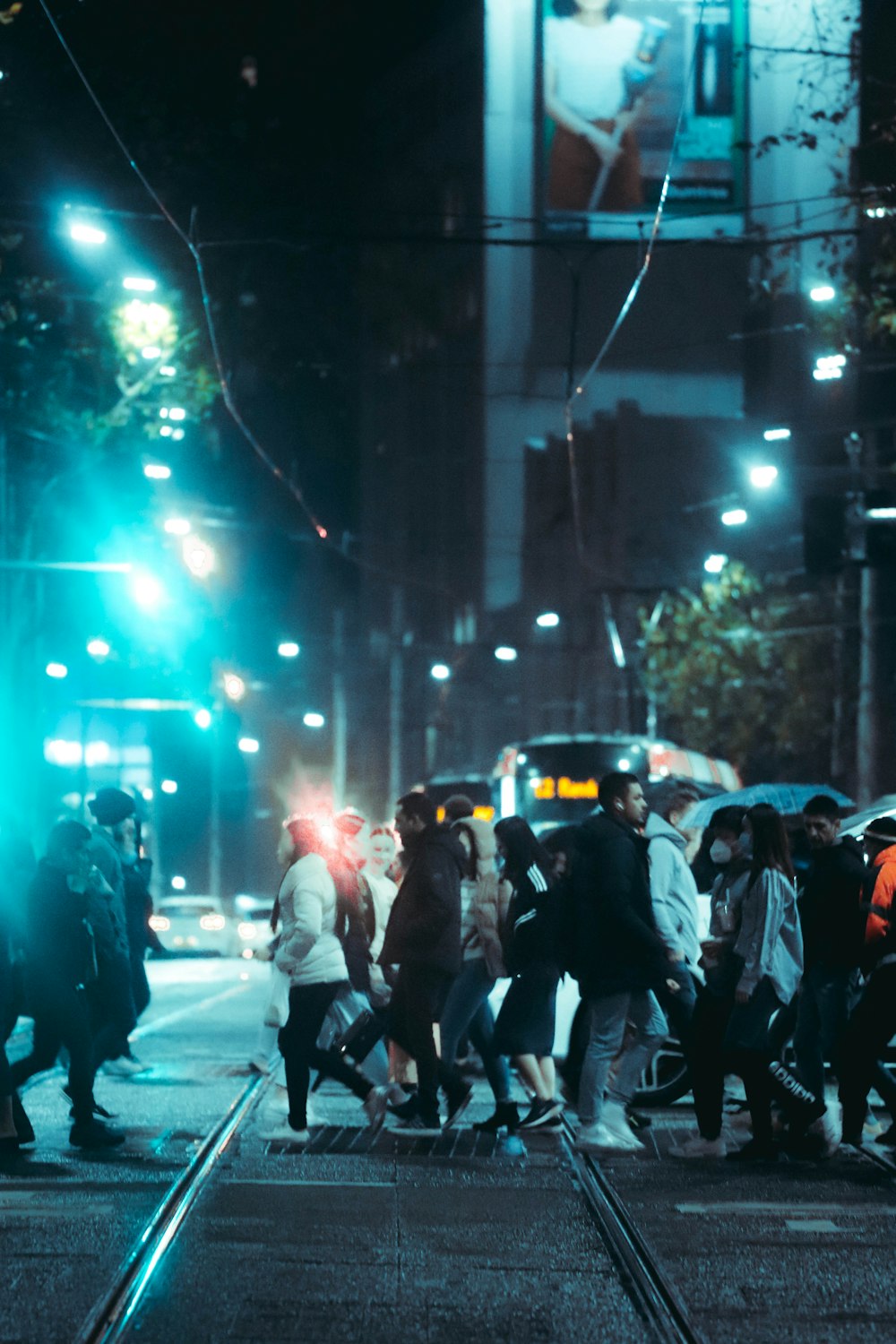 people walking on street during night time