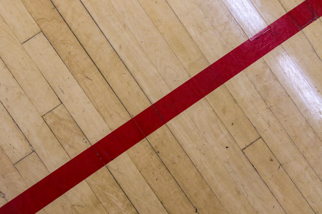 red strap on brown wooden floor