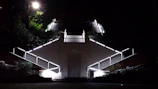 Bright motion sensor lighting illuminating a stairway in a Dove Mountain home.