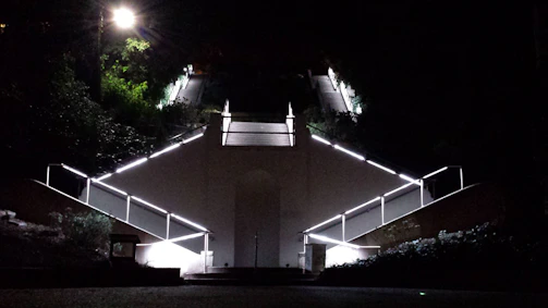 Bright motion sensor lighting illuminating a stairway in a Dove Mountain home.