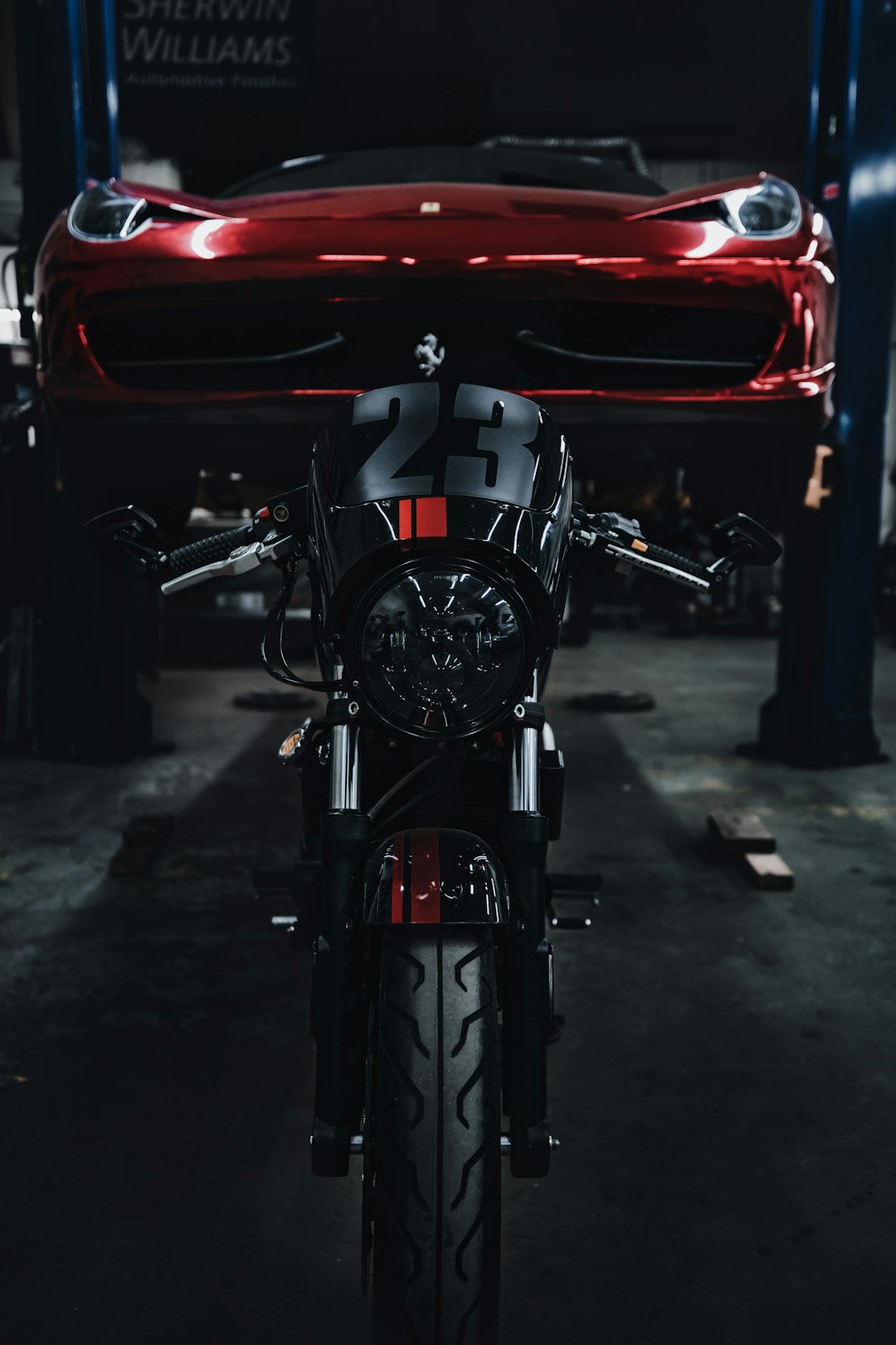 red and white motorcycle on gray concrete floor