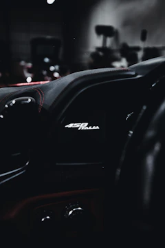 Close-up of Ferrari SF90’s dashboard alongside Cirrus Vision Jet’s cockpit instruments.