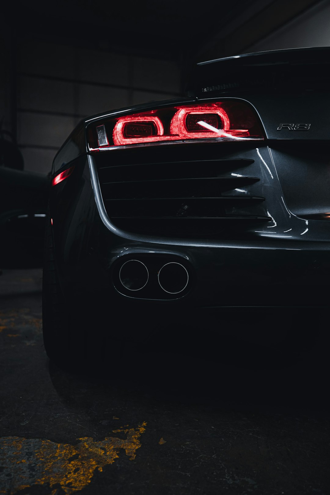 black and red car in a parking lot