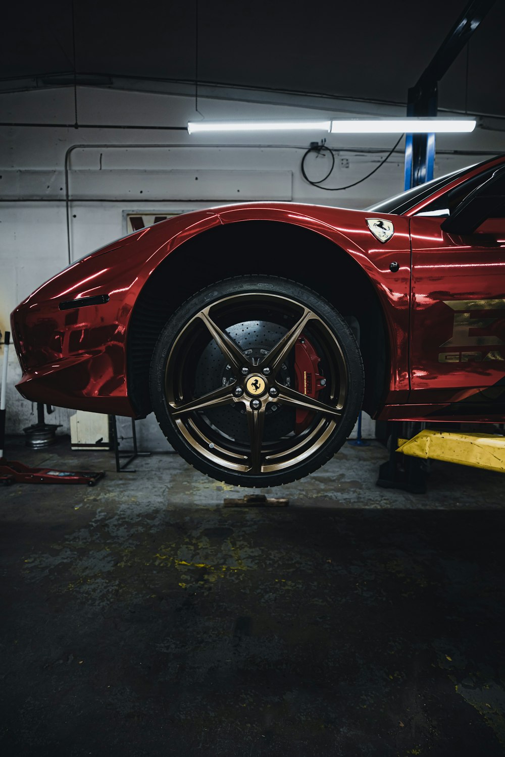 red car in a garage