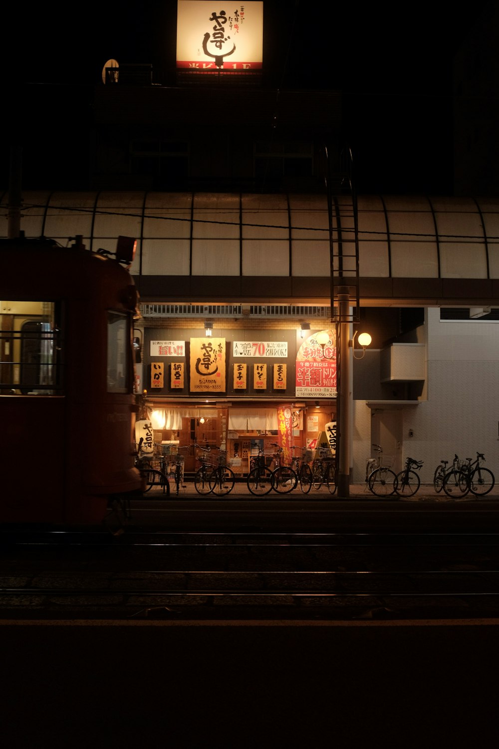 brown and white store front during night time