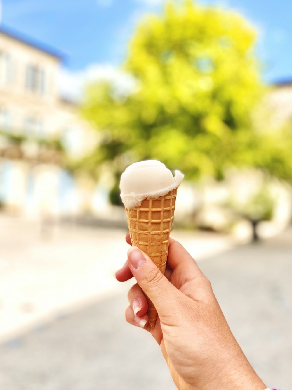 person holding ice cream cone