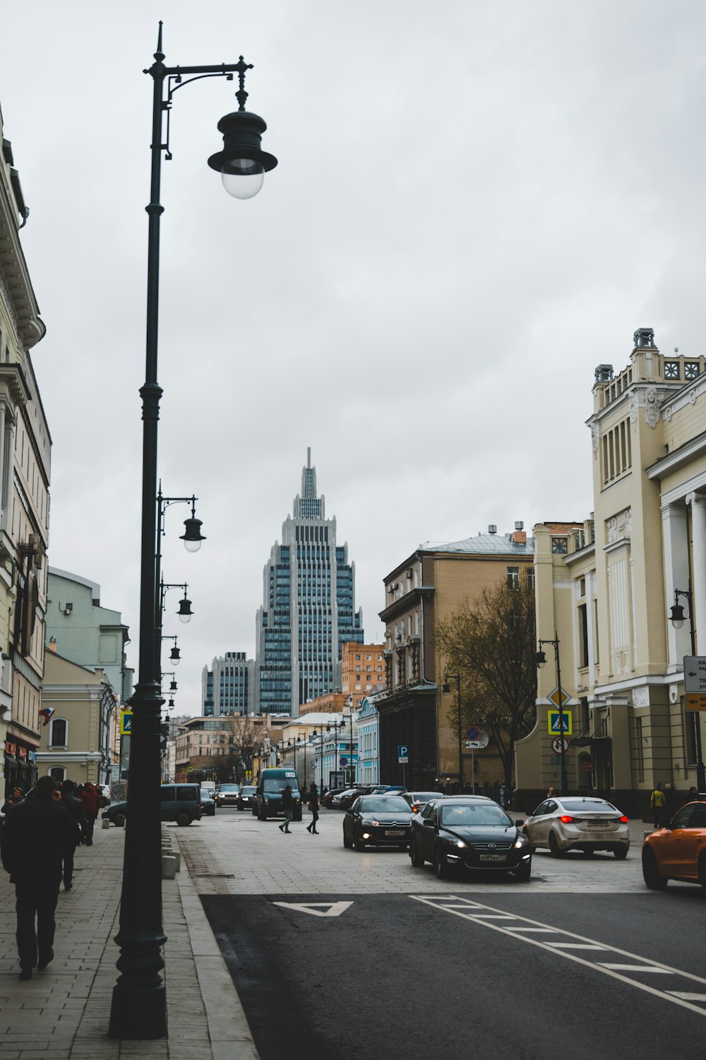 cars on road near buildings during daytime