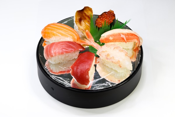 Raw meat on black ceramic plate