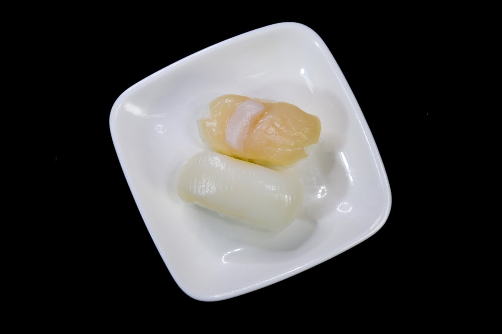 yellow cream on white ceramic plate