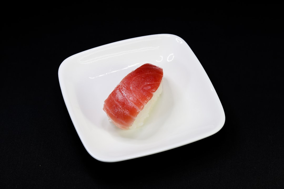 red sliced tomato on white ceramic plate