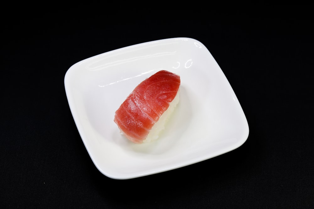 red sliced tomato on white ceramic plate