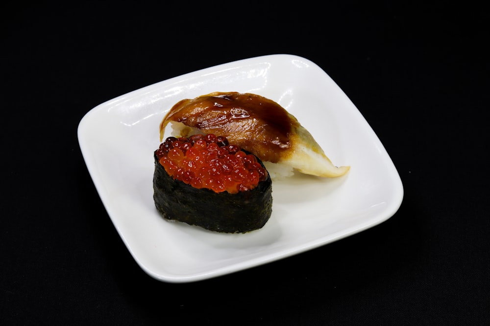 brown and black pastry on white ceramic plate