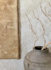 brown tree branch on gray concrete pot