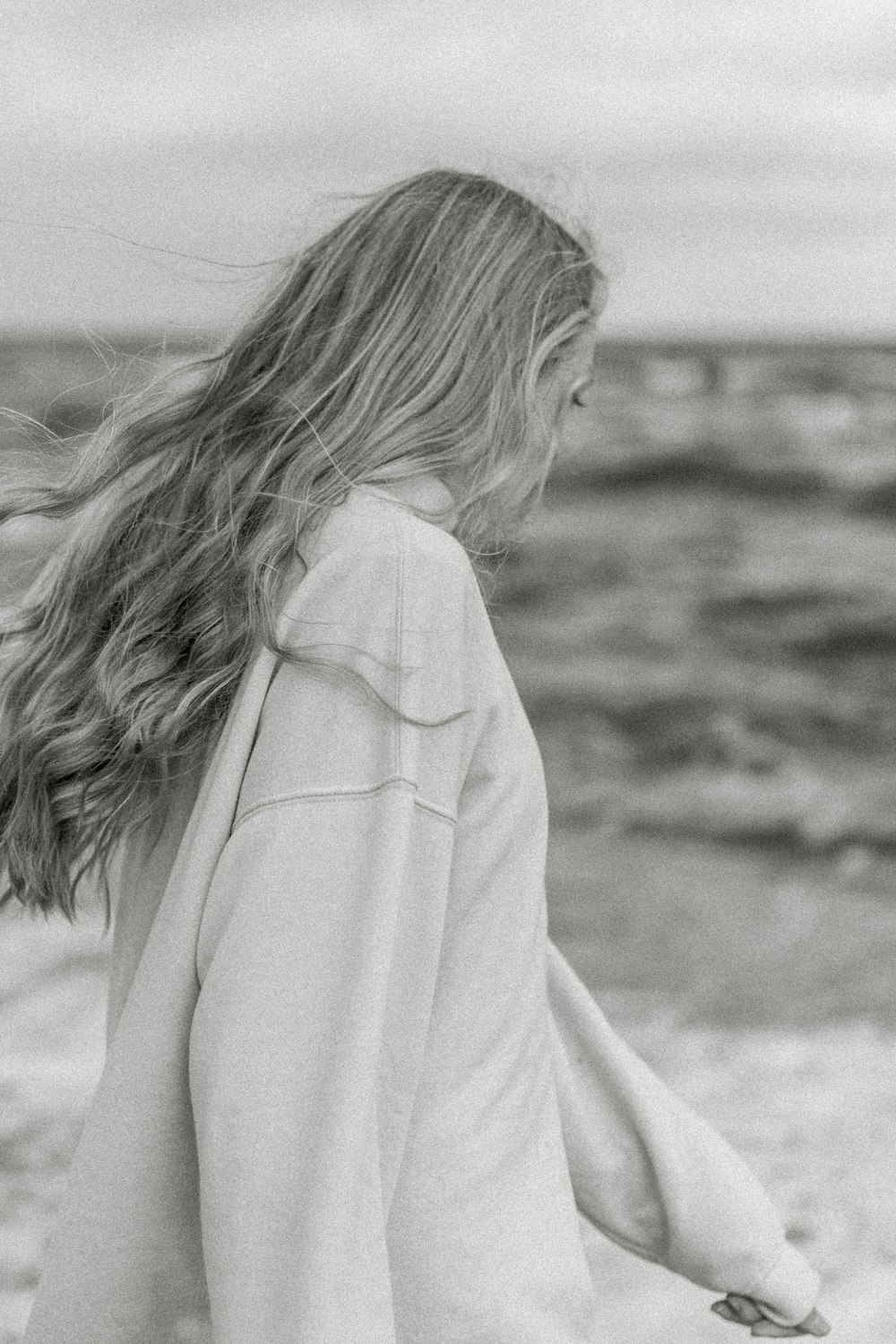 woman in white robe standing on field