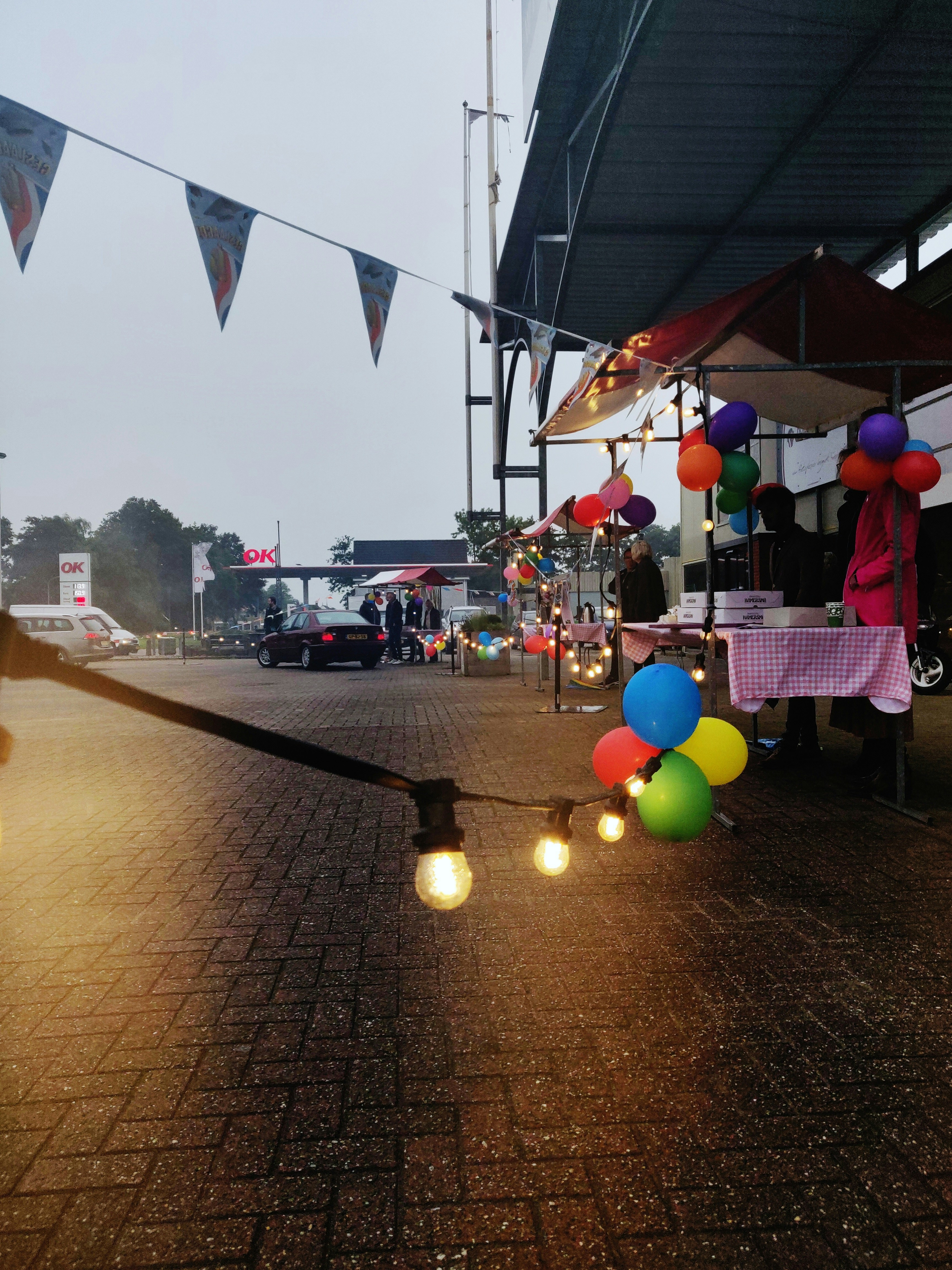 Colorful custom celebration event with festive lighting, decorated tables, and joyful party atmosphere