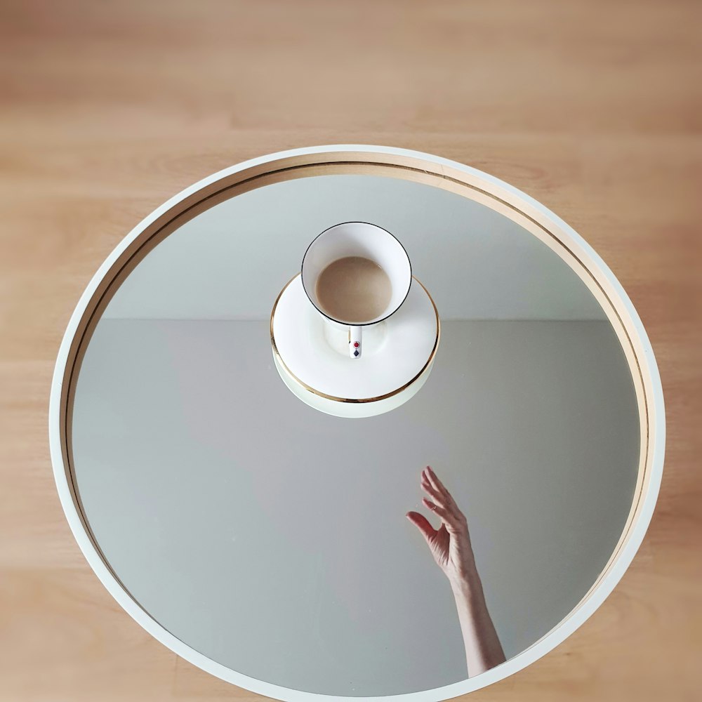 white round table on brown wooden floor