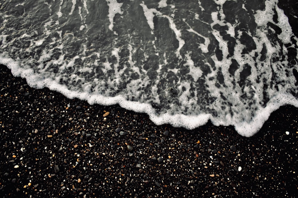 water waves on brown sand