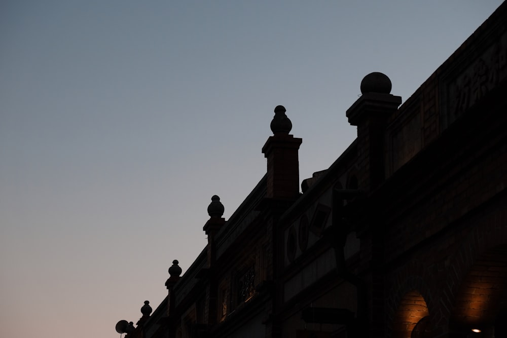 silhouette of building during sunset