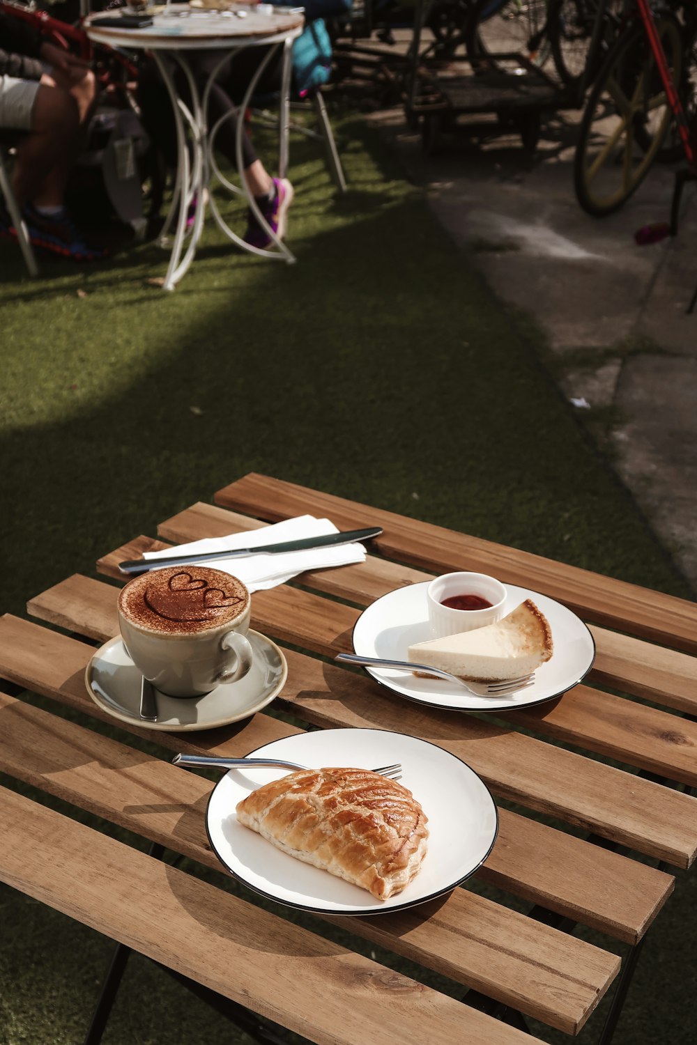 white ceramic teacup on white ceramic plate