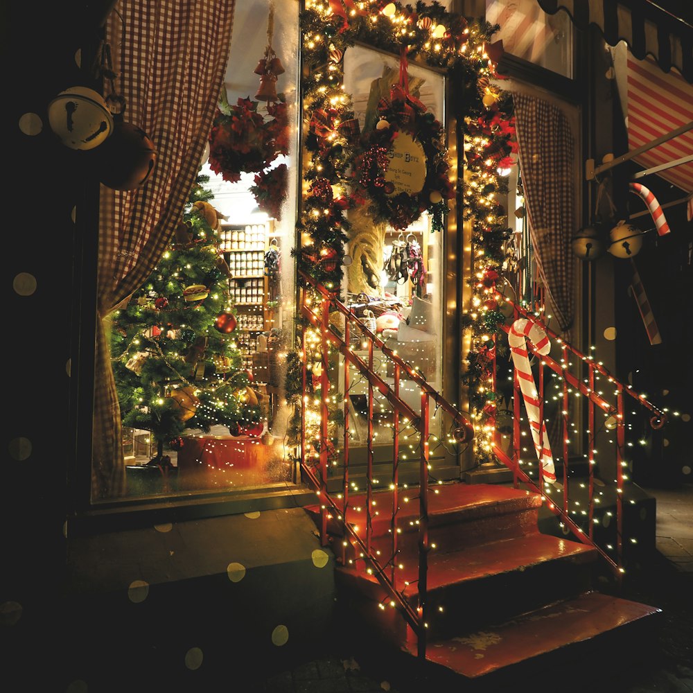 people walking on stairs with lighted string lights