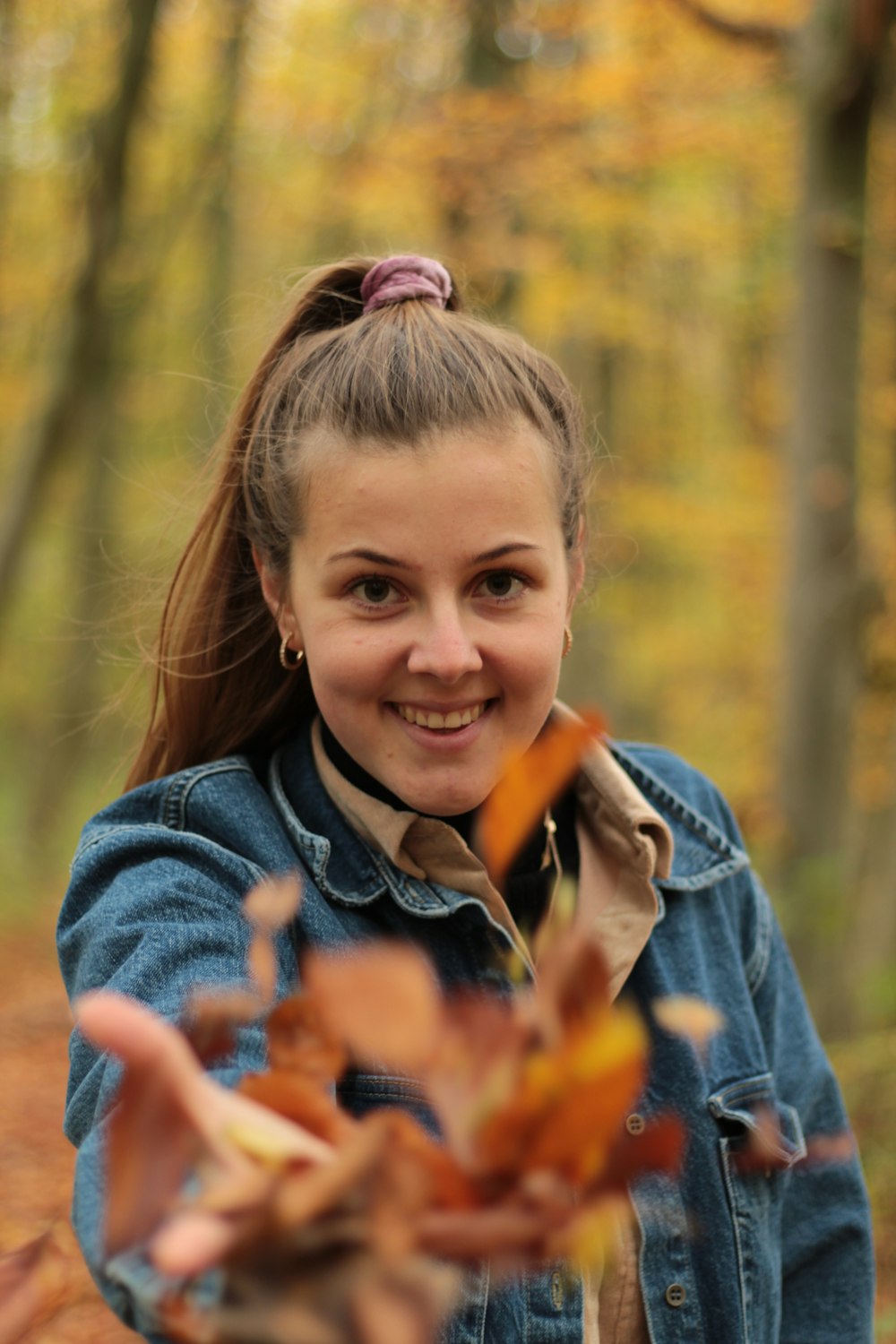 girl in blue denim jacket smiling