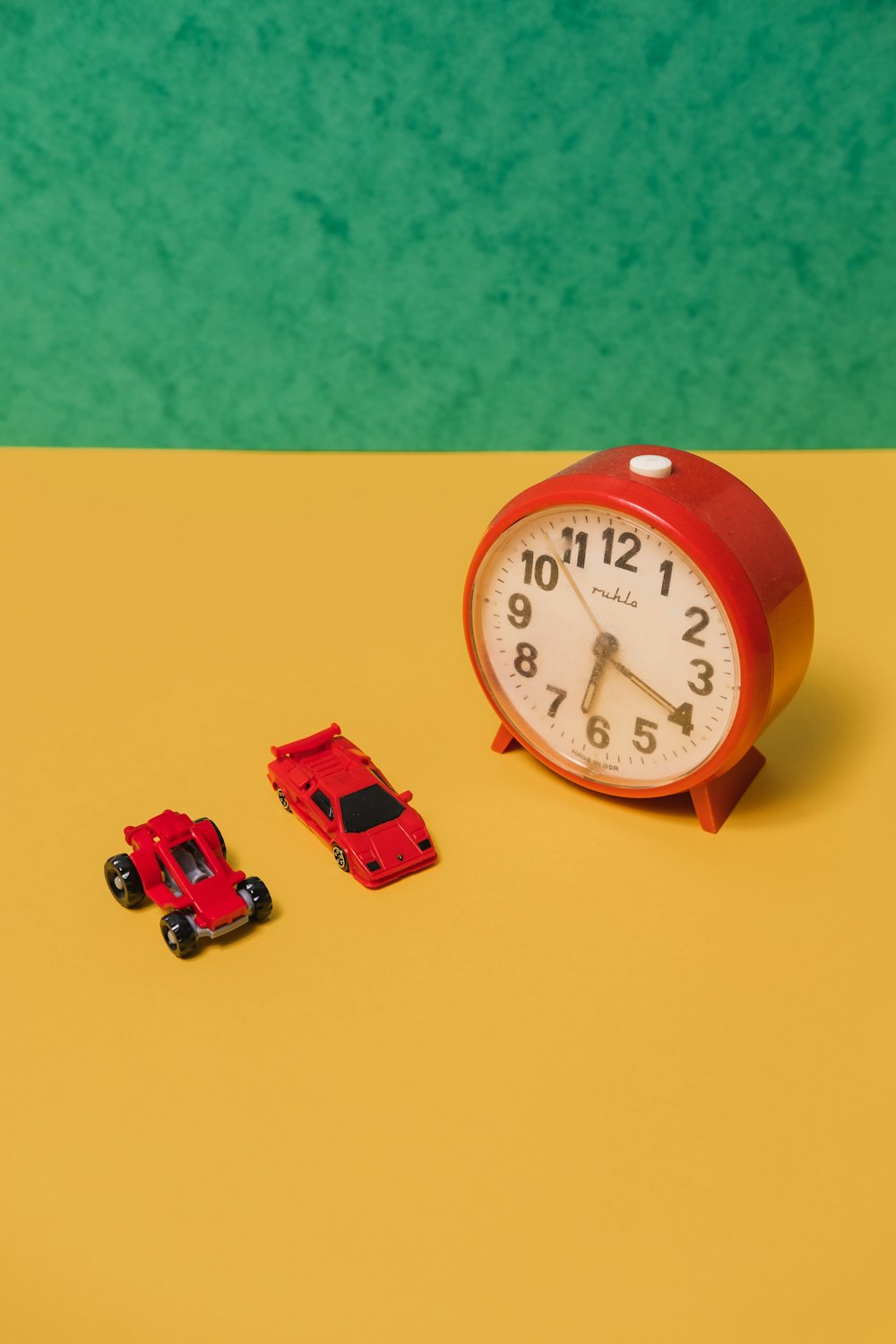 red and white analog wall clock