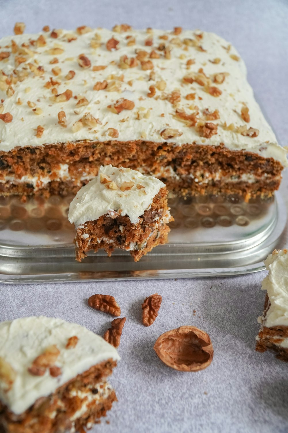 brown and white cake on clear plastic container