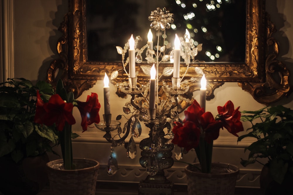 gold and white candle holder with candles