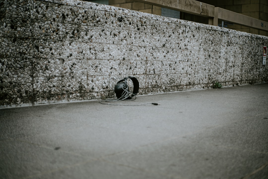 black bicycle helmet on gray concrete floor