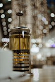 A french press that is full of presumably, tea