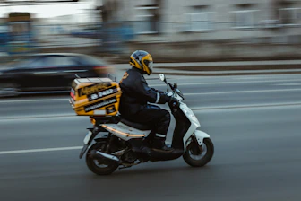man in black jacket riding motorcycle