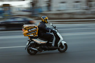 man in black jacket riding motorcycle