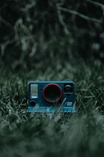 A modern instant camera capturing a joyful moment outdoors