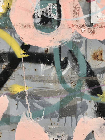 A detailed print of an urban art piece featuring layered brush strokes and paper textures