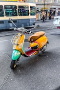 Brightly colored delivery motorcycle parked near a busy street in Porto Alegre