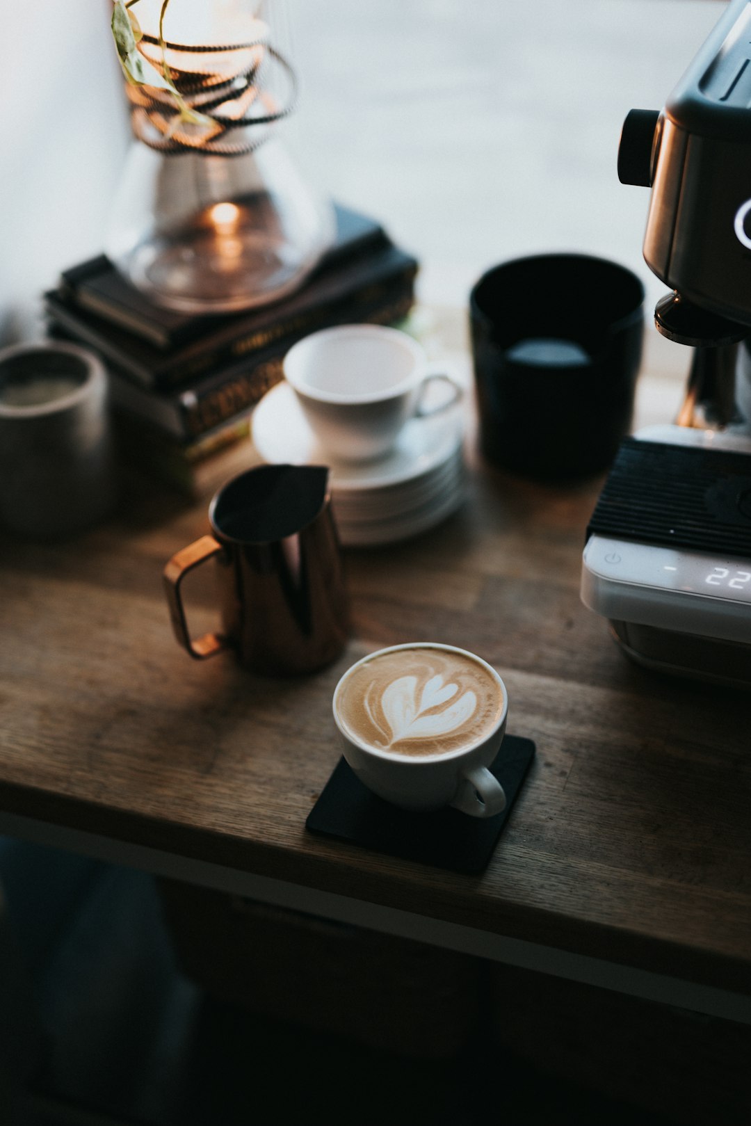 white ceramic mug on brown wooden table