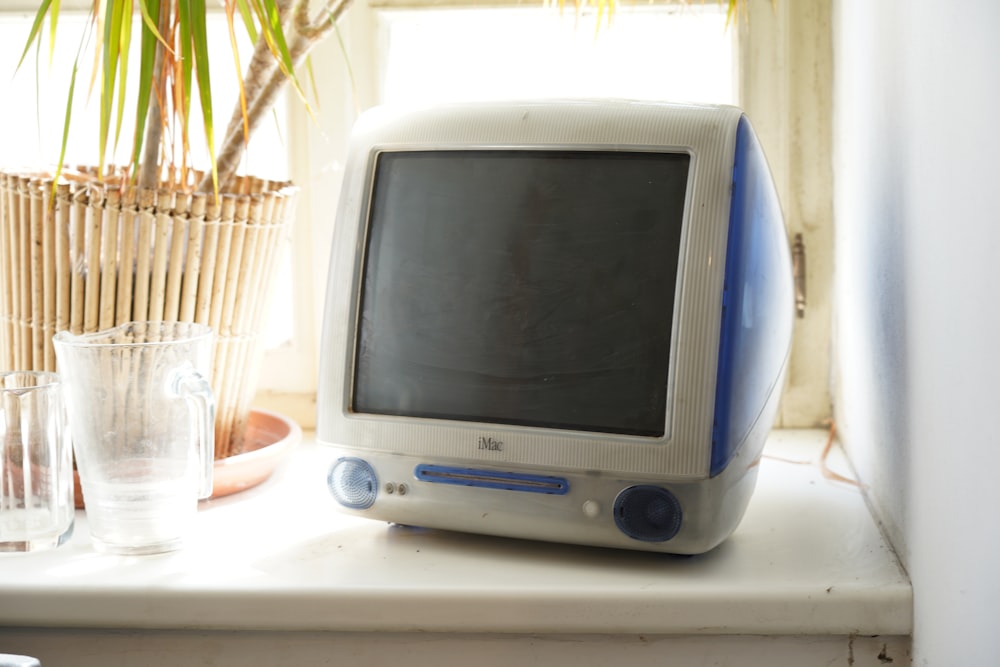 gray crt tv on white table