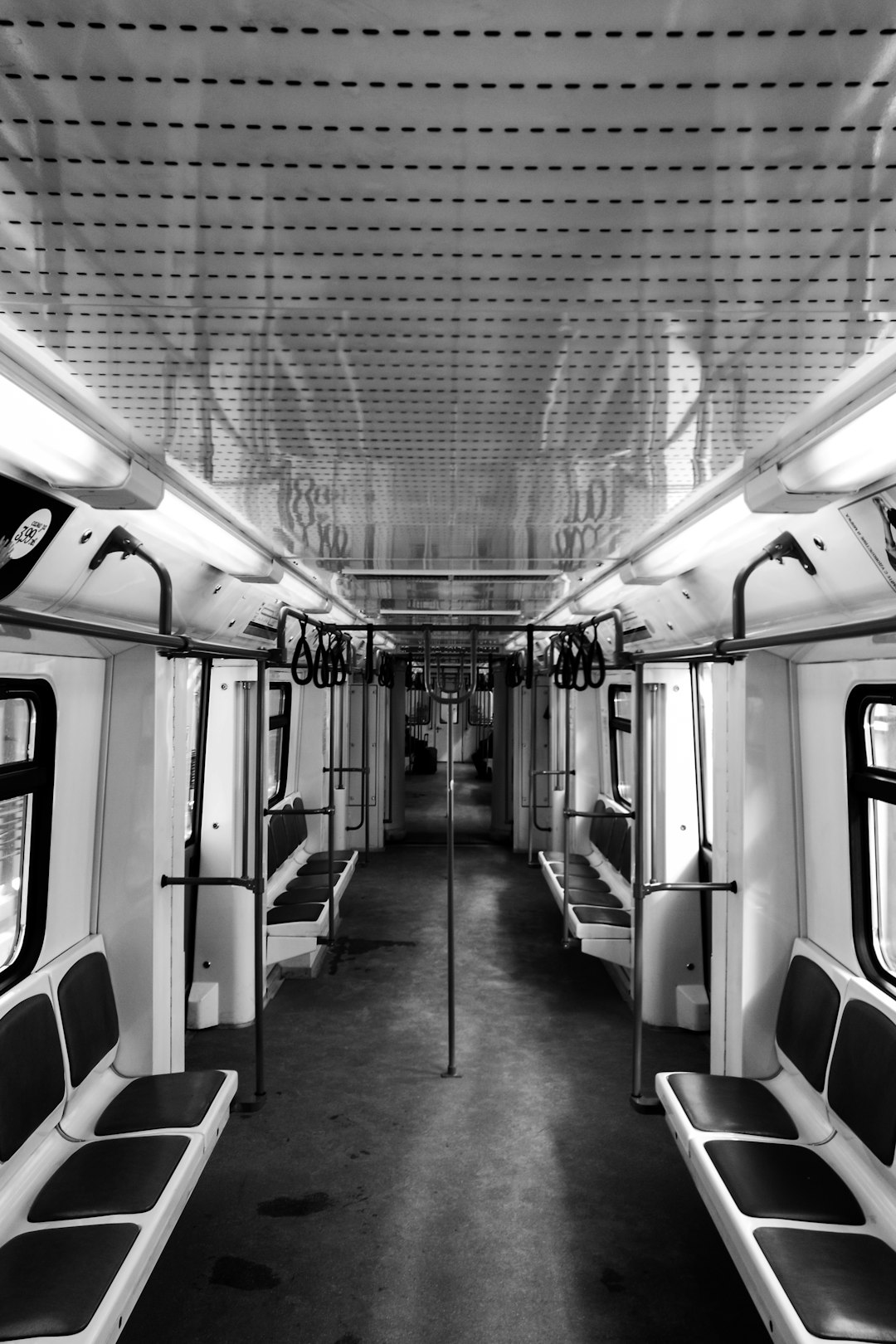 grayscale photo of train interior