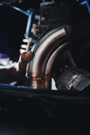person holding black steering wheel