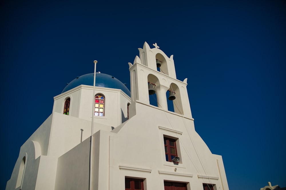 white concrete building under blue sky during daytime