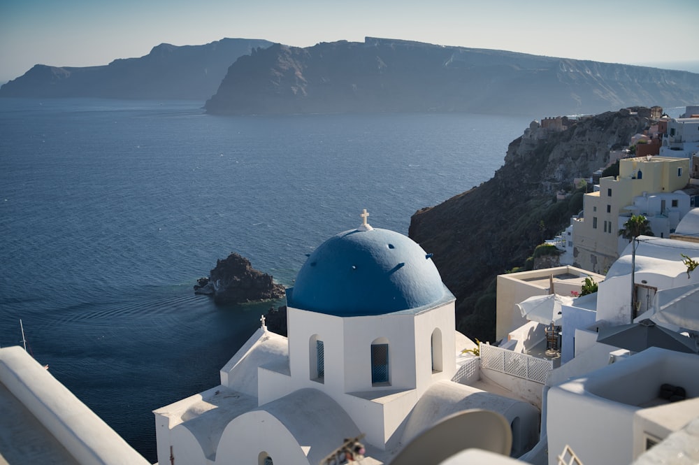 white and blue dome building near body of water during daytime