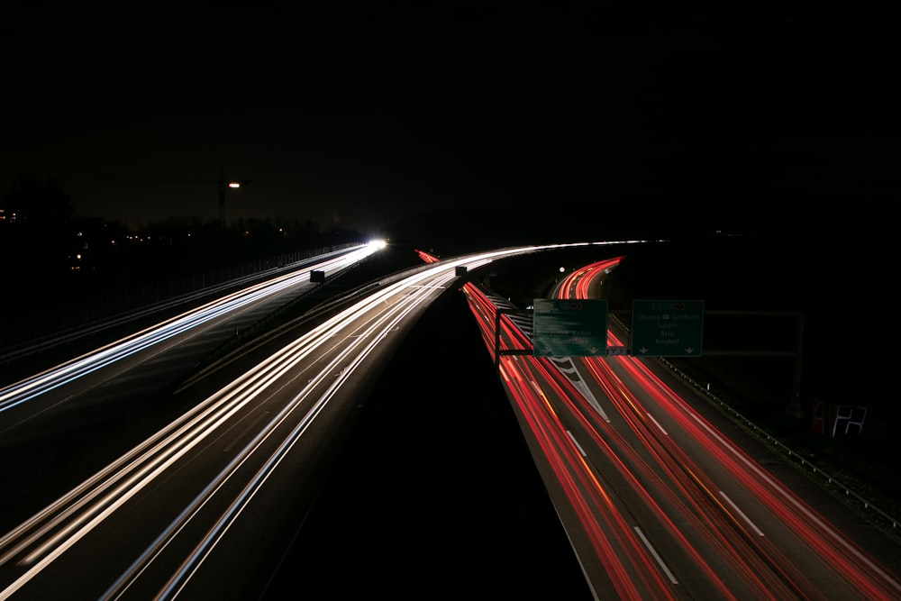 time lapse photography of cars on road during night time